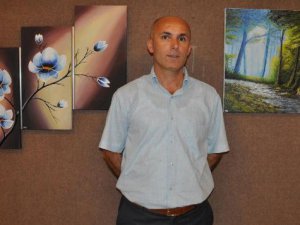 Tarsus'ta polis memuru Ahmet Abdan resim sergisi açtı